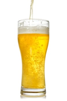 Cold beer pouring into glass. Isolated on white background