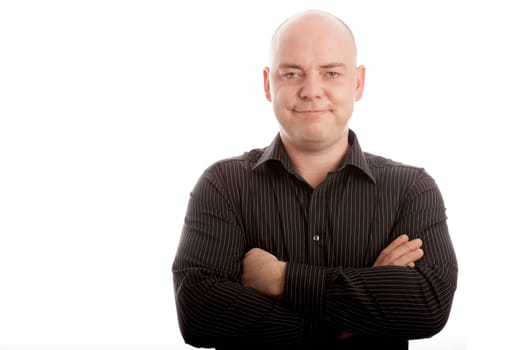bald man on withe background is smiling and satisfied