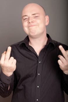 bald man on white background with middel finger