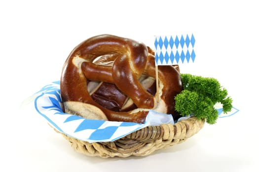 Pretzel pastries with parsley against a white background