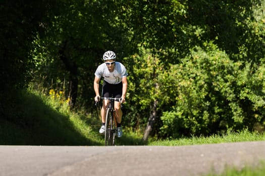Road cyclists pedaling out of the saddle