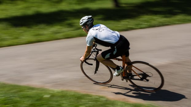 Road cyclist in motion blur