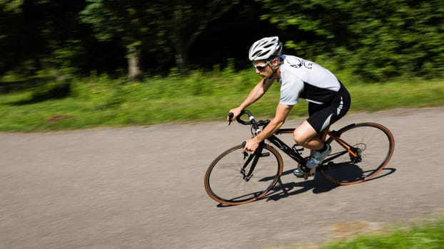 Road cyclist in motion blur