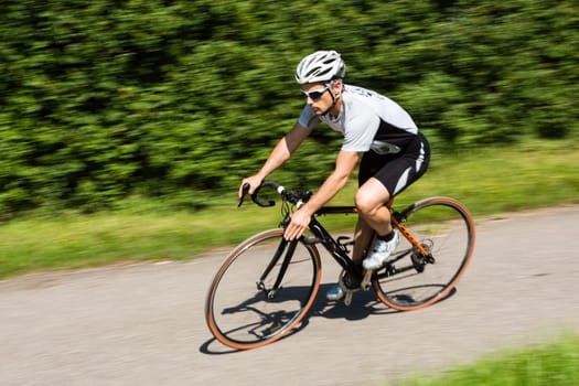 Road cyclist in motion blur