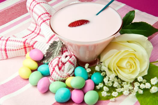 a  strawberry yogurt on a colored background