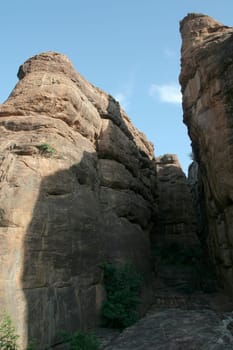 Play of sunshine and shadow on rock tips at Badami, Karnataka, India, Asia
