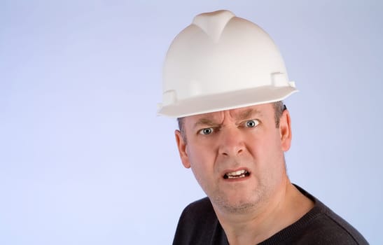 A construction worker is mad about something.