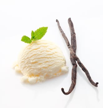 Creamy icecream and dried vanilla pods used as a flavouring ingredient during manufacture