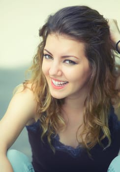Portrait of a beautiful 20 year old woman enjoying a summer day outdoor.