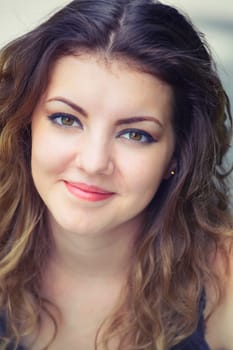 Portrait of a beautiful 20 year old woman enjoying a summer day outdoor.