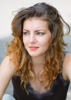 Portrait of a beautiful 20 year old woman enjoying a summer day outdoor.