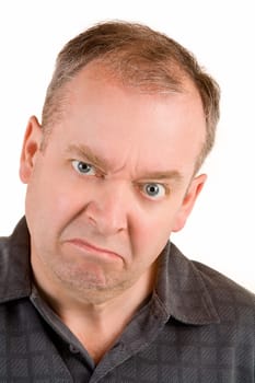 This is a portrait of a grumpy middle aged man.