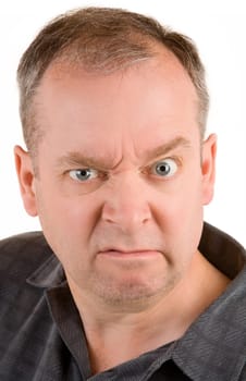 This is a portrait of a grumpy middle aged man.