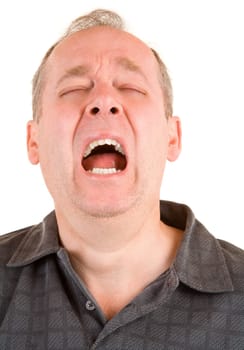 A middle aged man is sneezing loudly.
