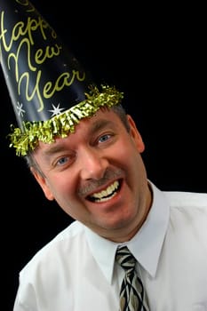 Man wearing "New Year party"" hat and cheering the people in front of him."
