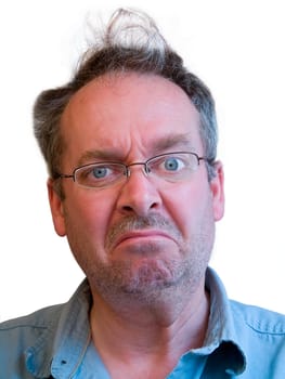 Portrait of a grumpy man with unkempt hair and a neglected appearance.