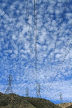 Electrical power pylon with dramatic background clouds