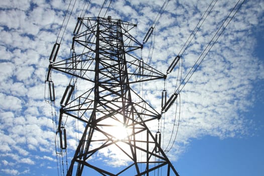 Electrical power pylon with dramatic background clouds