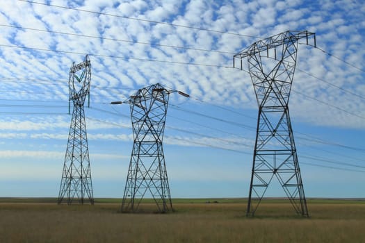 Electrical power pylon with dramatic background clouds