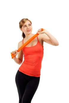 Young sportswoman with a fitness band against a white background