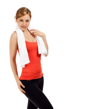 Pretty young sportswoman with a towel against white background