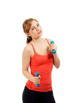 Young sportswoman exercising with fitness dumbbells against white background