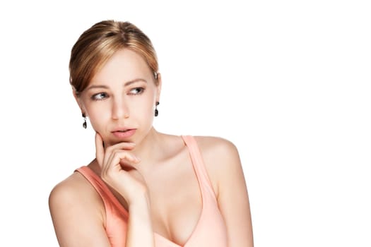 Thinking young beautiful blonde woman looking to the side against white background