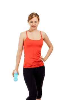 Pretty fitness woman with a bottle of water against a white background