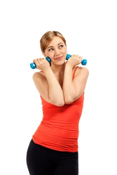 Pretty young fitness woman holding dumbbells to her face against white background