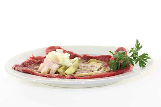 raw beef roulade with bacon,onion and cucumber
