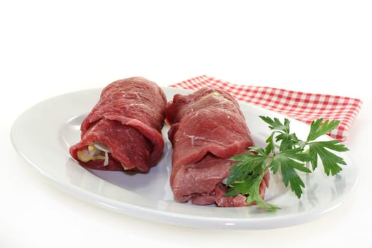 raw beef roulade with bacon,onion and cucumber
