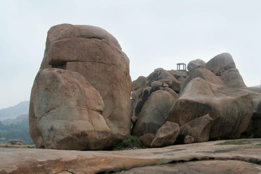 Huge rock boulders and watch tower on Hemakoota Temples Hill at Hampi, Karnataka, India, Asia