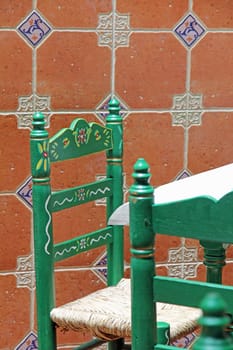 green chair at the table