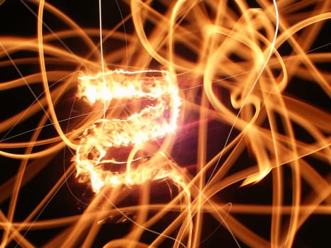 Streaks of flame light up the night.