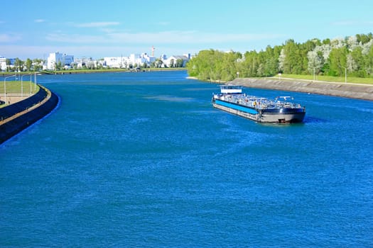 Cargo ship at the Rhine lock and Grens crossing near Marckolsheim (France) and Sasbach am Kaiserstuhl (Germany)