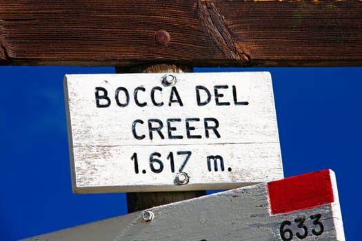 Sign and hiking trail sign at Monte Baldo (Lake Garda),Monte Baldo high road at the pass at the Bocca del Creer (1617m),Italy