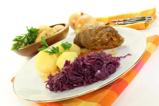 braised beef roulade with potatoes and red cabbage
