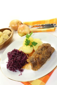 braised beef roulade with potatoes and red cabbage