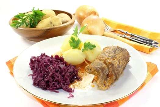 braised beef roulade with potatoes and red cabbage