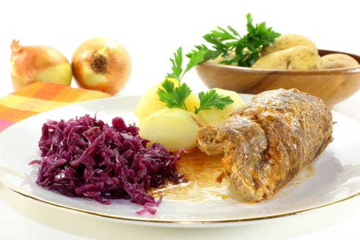 braised beef roulade with potatoes and red cabbage