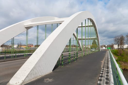 concrete white arch bridge in Enschede, Netherlands