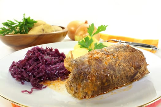 braised beef roulade with potatoes and red cabbage