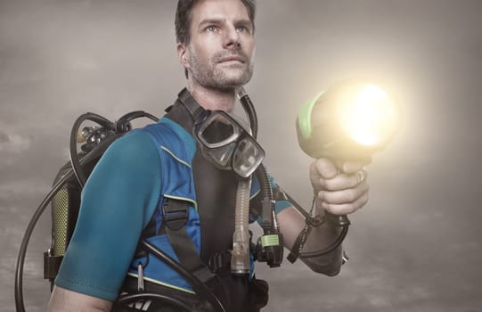 Diver with oxygen tank and a lamp