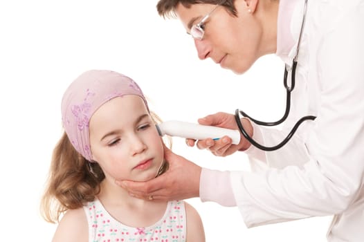 Toddler at pediatrician in front of white background