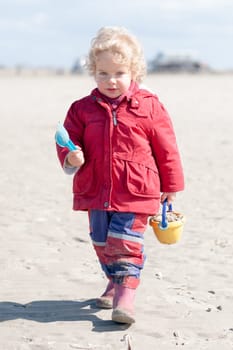 Toddler running on the beach