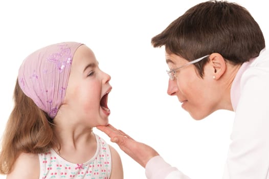 Toddler at pediatrician in front of white background