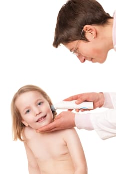 Toddler at pediatrician in front of white background
