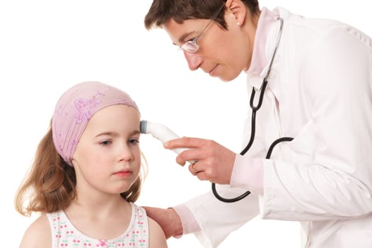Toddler at pediatrician in front of white background