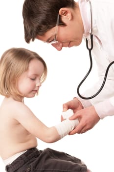 Toddler at pediatrician in front of white background