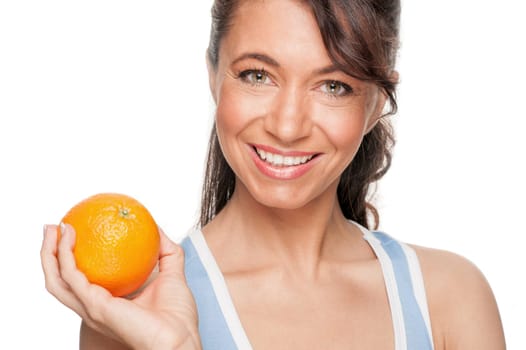 Smiling woman in front of white background with an orange